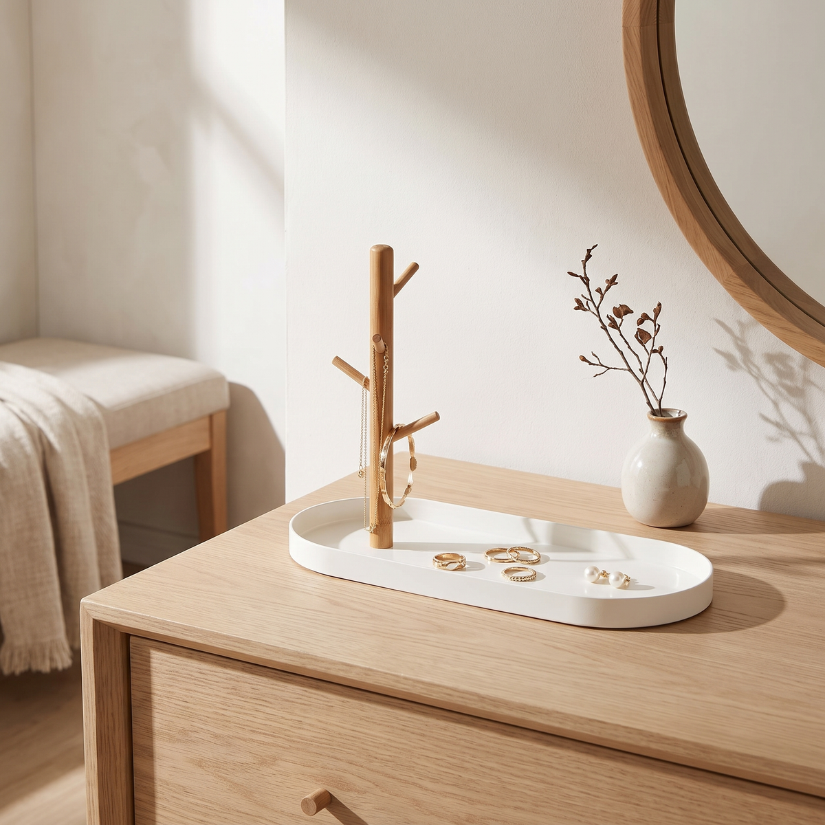 White tray with wooden jewellery rack on a dresser