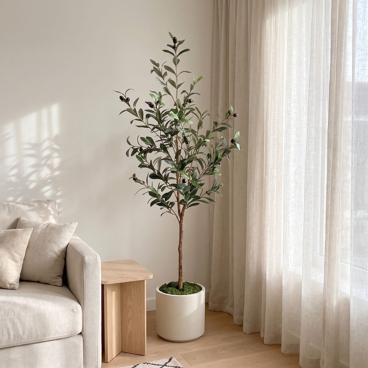 Artificial olive tree in the corner of a bright living room